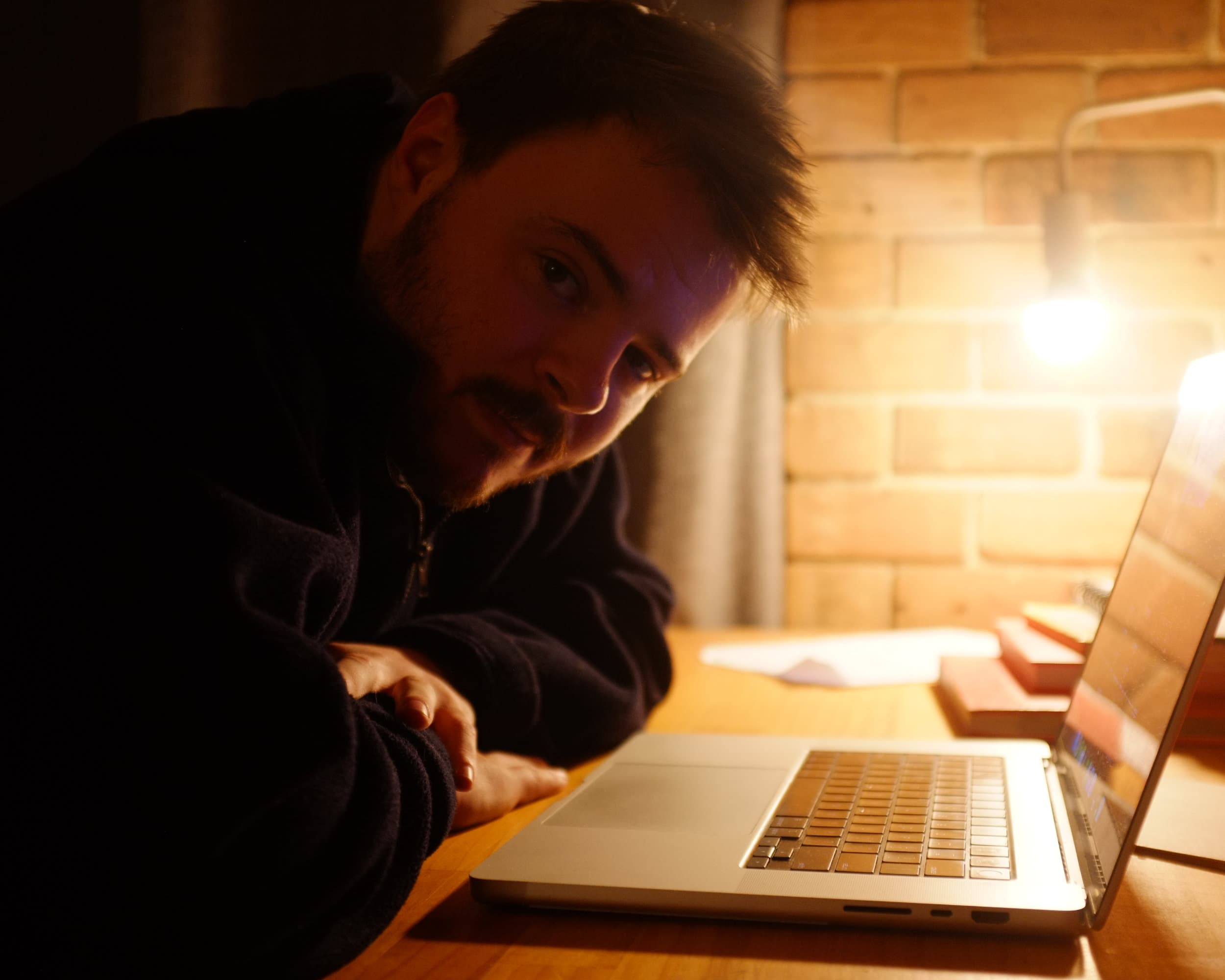 Isaac Rees working at his desk